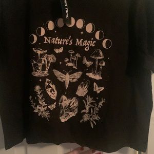 Hot topic crop top says Natures Magic. Size medium.